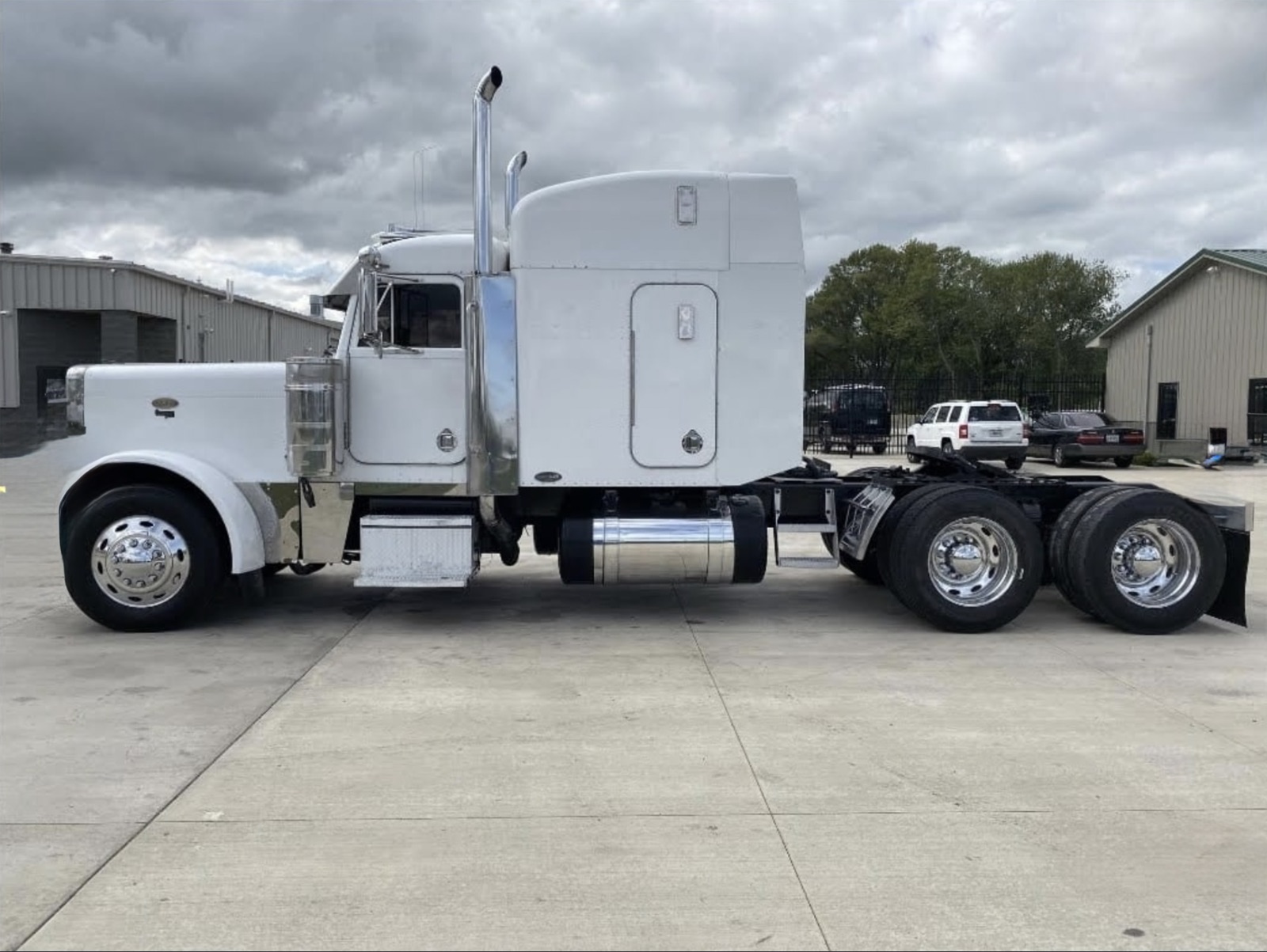SFam Logistics white Peterbilt sleeper tractor